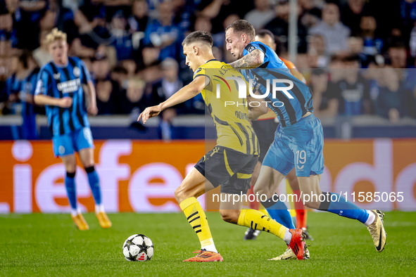 Borussia Dortmund defender Nico Schlotterbeck and Club Brugge forward Gustaf Nilsson during the match between Club Brugge and Borussia Dortm...