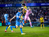 Borussia Dortmund forward Karim Adeyemi, Club Brugge goalkeeper Simon Mignolet, and Club Brugge defender Joaquin Seys during the match betwe...