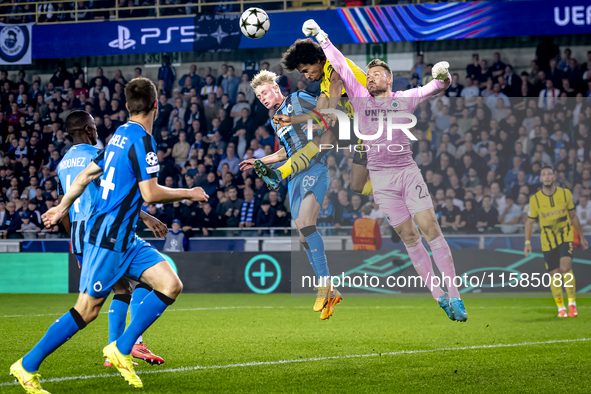 Borussia Dortmund forward Karim Adeyemi, Club Brugge goalkeeper Simon Mignolet, and Club Brugge defender Joaquin Seys during the match betwe...