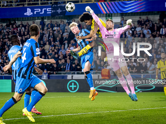 Borussia Dortmund forward Karim Adeyemi, Club Brugge goalkeeper Simon Mignolet, and Club Brugge defender Joaquin Seys during the match betwe...