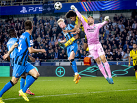 Borussia Dortmund forward Karim Adeyemi, Club Brugge goalkeeper Simon Mignolet, and Club Brugge defender Joaquin Seys during the match betwe...