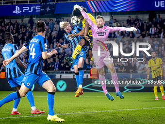 Borussia Dortmund forward Karim Adeyemi, Club Brugge goalkeeper Simon Mignolet, and Club Brugge defender Joaquin Seys during the match betwe...