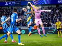 Borussia Dortmund forward Karim Adeyemi, Club Brugge goalkeeper Simon Mignolet, and Club Brugge defender Joaquin Seys during the match betwe...