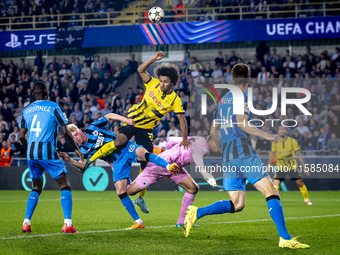 Borussia Dortmund forward Karim Adeyemi, Club Brugge goalkeeper Simon Mignolet, and Club Brugge defender Joaquin Seys during the match betwe...