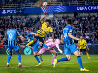 Borussia Dortmund forward Karim Adeyemi, Club Brugge goalkeeper Simon Mignolet, and Club Brugge defender Joaquin Seys during the match betwe...