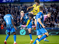 Borussia Dortmund forward Karim Adeyemi, Club Brugge goalkeeper Simon Mignolet, and Club Brugge defender Joaquin Seys during the match betwe...