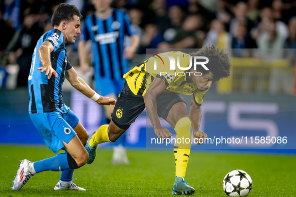 Club Brugge midfielder Hugo Vetlesen and Borussia Dortmund forward Karim Adeyemi during the match between Club Brugge and Borussia Dortmund...