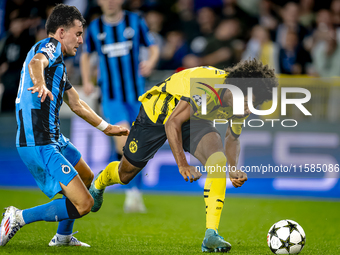 Club Brugge midfielder Hugo Vetlesen and Borussia Dortmund forward Karim Adeyemi during the match between Club Brugge and Borussia Dortmund...