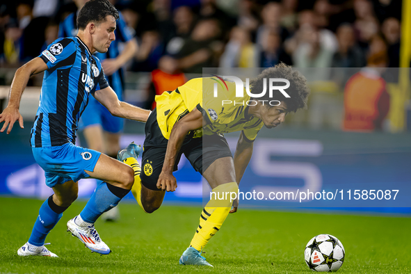 Club Brugge midfielder Hugo Vetlesen and Borussia Dortmund forward Karim Adeyemi during the match between Club Brugge and Borussia Dortmund...