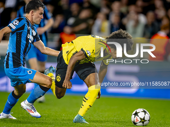 Club Brugge midfielder Hugo Vetlesen and Borussia Dortmund forward Karim Adeyemi during the match between Club Brugge and Borussia Dortmund...