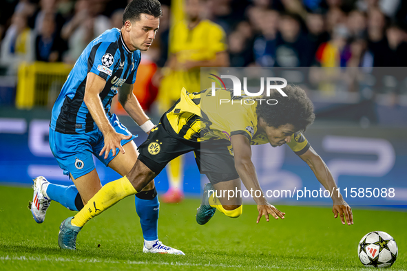 Club Brugge midfielder Hugo Vetlesen and Borussia Dortmund forward Karim Adeyemi during the match between Club Brugge and Borussia Dortmund...