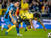 Club Brugge midfielder Hugo Vetlesen and Borussia Dortmund forward Karim Adeyemi during the match between Club Brugge and Borussia Dortmund...