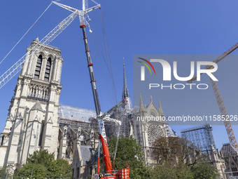 An exterior view of Notre Dame and construction cranes while the reconstruction process takes place in Paris, France, on September 15, 2024....