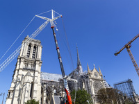 An exterior view of Notre Dame and construction cranes while the reconstruction process takes place in Paris, France, on September 15, 2024....