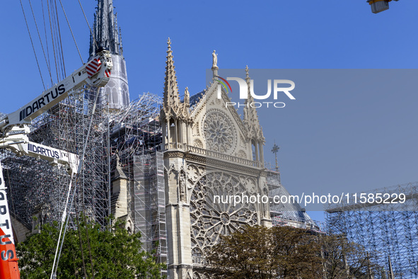 An exterior view of Notre Dame and construction cranes while the reconstruction process takes place in Paris, France, on September 15, 2024....