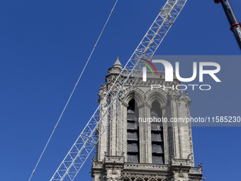 An exterior view of Notre Dame and construction cranes while the reconstruction process takes place in Paris, France, on September 15, 2024....