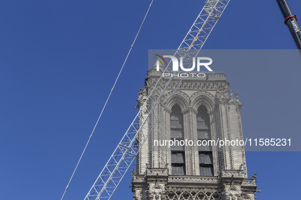 An exterior view of Notre Dame and construction cranes while the reconstruction process takes place in Paris, France, on September 15, 2024....