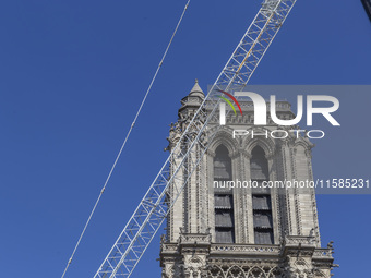 An exterior view of Notre Dame and construction cranes while the reconstruction process takes place in Paris, France, on September 15, 2024....