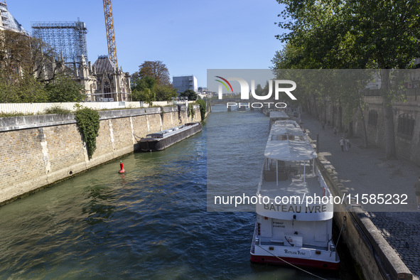 An exterior view of Notre Dame and construction cranes while the reconstruction process takes place in Paris, France, on September 15, 2024....