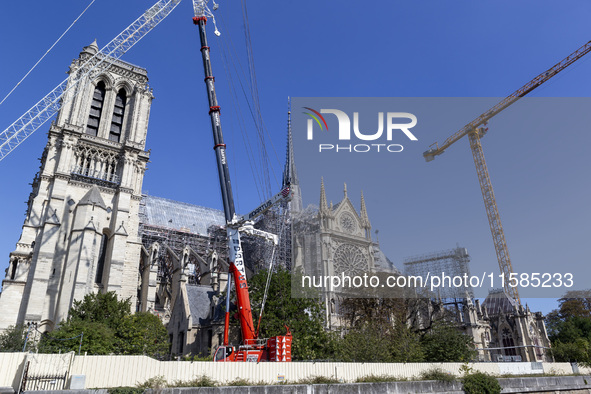 An exterior view of Notre Dame and construction cranes while the reconstruction process takes place in Paris, France, on September 15, 2024....