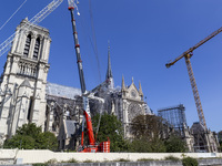 An exterior view of Notre Dame and construction cranes while the reconstruction process takes place in Paris, France, on September 15, 2024....