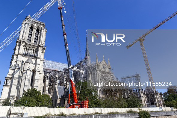 An exterior view of Notre Dame and construction cranes while the reconstruction process takes place in Paris, France, on September 15, 2024....