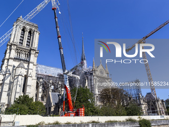 An exterior view of Notre Dame and construction cranes while the reconstruction process takes place in Paris, France, on September 15, 2024....