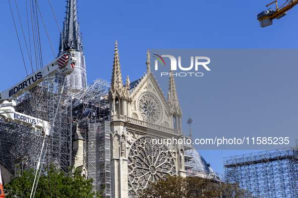 An exterior view of Notre Dame and construction cranes while the reconstruction process takes place in Paris, France, on September 15, 2024....