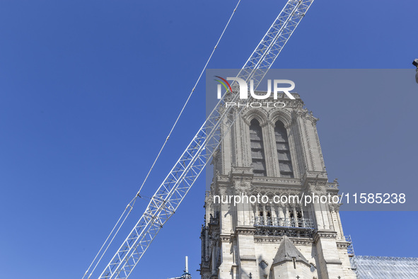 An exterior view of Notre Dame and construction cranes while the reconstruction process takes place in Paris, France, on September 15, 2024....