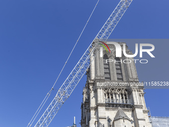 An exterior view of Notre Dame and construction cranes while the reconstruction process takes place in Paris, France, on September 15, 2024....