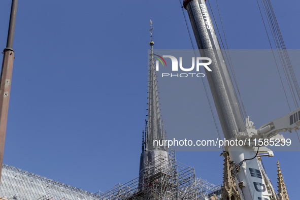 An exterior view of Notre Dame and construction cranes while the reconstruction process takes place in Paris, France, on September 15, 2024....