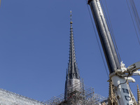 An exterior view of Notre Dame and construction cranes while the reconstruction process takes place in Paris, France, on September 15, 2024....