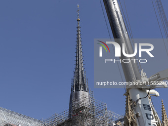 An exterior view of Notre Dame and construction cranes while the reconstruction process takes place in Paris, France, on September 15, 2024....