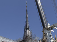 An exterior view of Notre Dame and construction cranes while the reconstruction process takes place in Paris, France, on September 15, 2024....