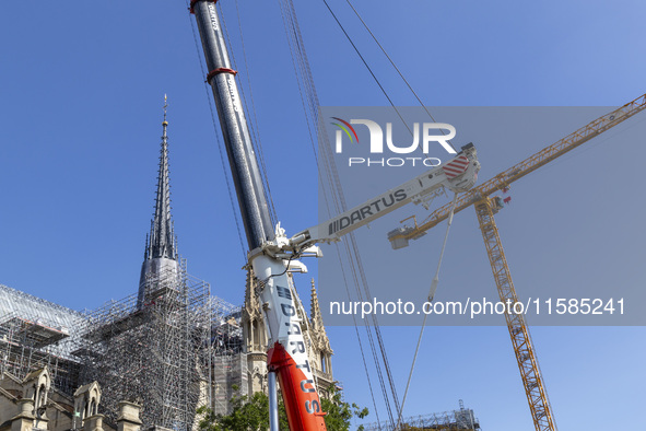 An exterior view of Notre Dame and construction cranes while the reconstruction process takes place in Paris, France, on September 15, 2024....