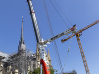 An exterior view of Notre Dame and construction cranes while the reconstruction process takes place in Paris, France, on September 15, 2024....