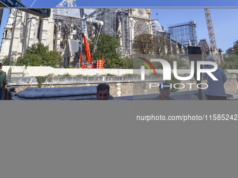 An exterior view of Notre Dame and construction cranes while the reconstruction process takes place in Paris, France, on September 15, 2024....