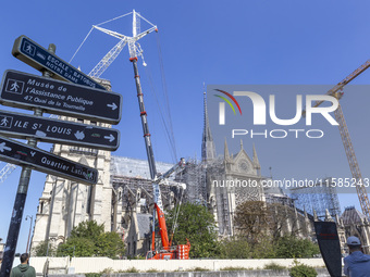 An exterior view of Notre Dame and construction cranes while the reconstruction process takes place in Paris, France, on September 15, 2024....