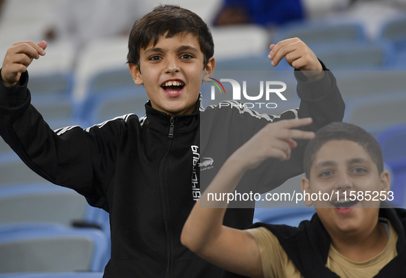 Al Wakrah SC supporters cheer for their team before the AFC Champions League Two Group A football match between Qatar's Al Wakrah SC and Ira...