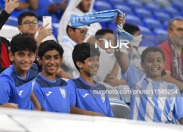 Al Wakrah SC supporters cheer for their team before the AFC Champions League Two Group A football match between Qatar's Al Wakrah SC and Ira...