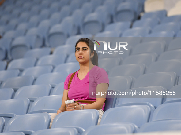 An Al Wakrah SC supporter cheers for their team before the AFC Champions League Two Group A football match between Qatar's Al Wakrah SC and...