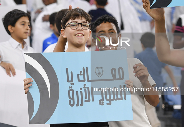 Al Wakrah SC supporters cheer for their team before the AFC Champions League Two Group A football match between Qatar's Al Wakrah SC and Ira...