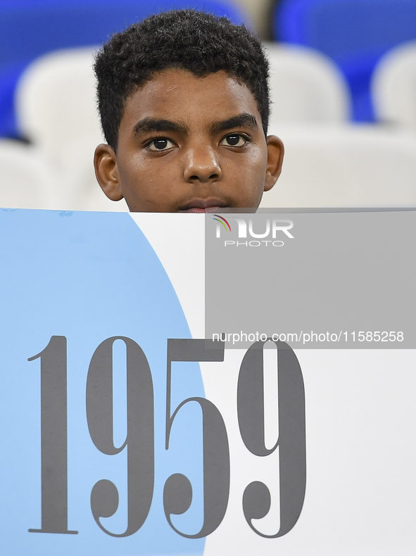 An Al Wakrah SC supporter cheers for their team before the AFC Champions League Two Group A football match between Qatar's Al Wakrah SC and...