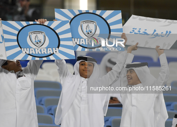 Al Wakrah SC supporters cheer for their team before the AFC Champions League Two Group A football match between Qatar's Al Wakrah SC and Ira...