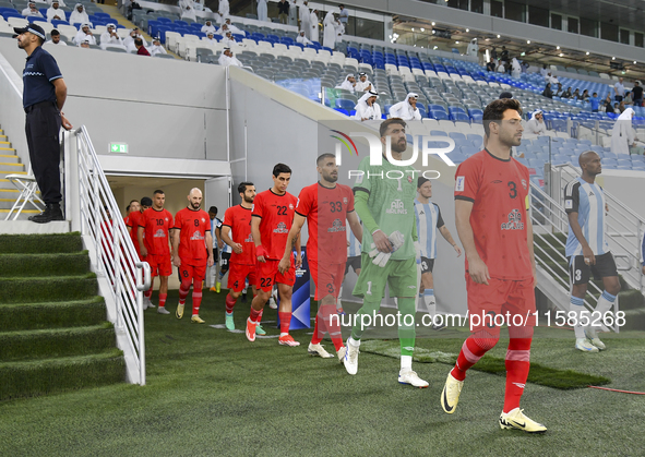 Tractor SC and Al Wakrah players walk onto the pitch before the AFC Champions League Two Group A football match between Qatar's Al Wakrah SC...