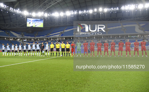 Tractor SC and Al Wakrah teams line up prior to the AFC Champions League Two Group A football match between Qatar's Al Wakrah SC and Iran's...