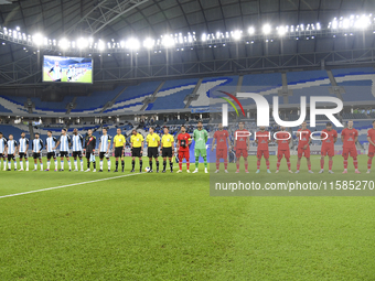 Tractor SC and Al Wakrah teams line up prior to the AFC Champions League Two Group A football match between Qatar's Al Wakrah SC and Iran's...