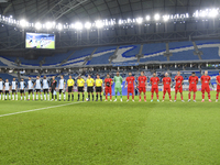 Tractor SC and Al Wakrah teams line up prior to the AFC Champions League Two Group A football match between Qatar's Al Wakrah SC and Iran's...