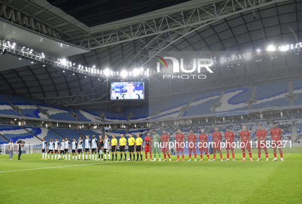 Tractor SC and Al Wakrah teams line up prior to the AFC Champions League Two Group A football match between Qatar's Al Wakrah SC and Iran's...