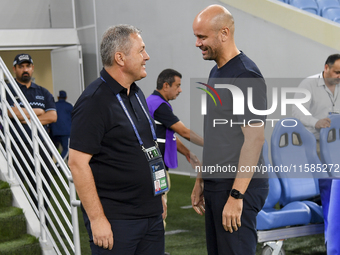 Dragan Skocic, head coach of Tractor SC, and Miguel Angel Ramirez Medina, head coach of Al Wakrah SC, react prior to the AFC Champions Leagu...